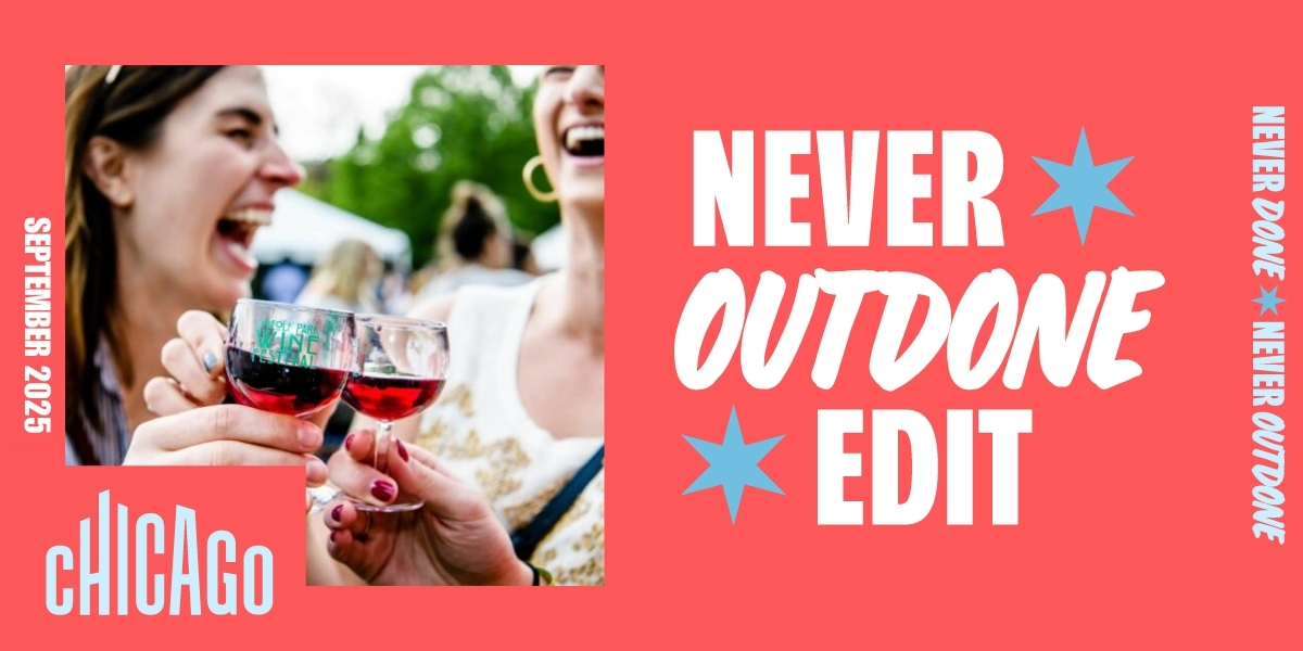 Two women toast with glasses of red wine at an outdoor Chicago festival