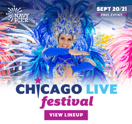 A dancer in a feathered, cobalt blue costume and headdress performs during Chicago Live! at Navy Pier in Chicago