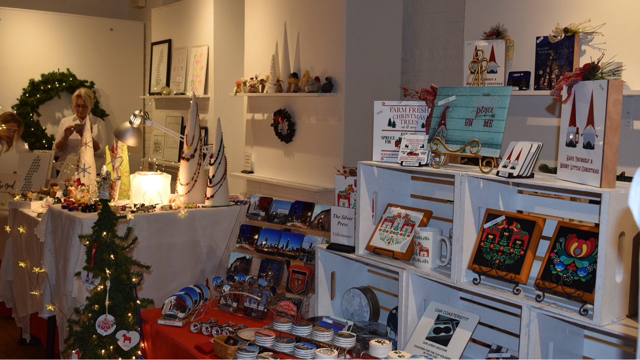 A holiday market booth displaying artisan-made gift items