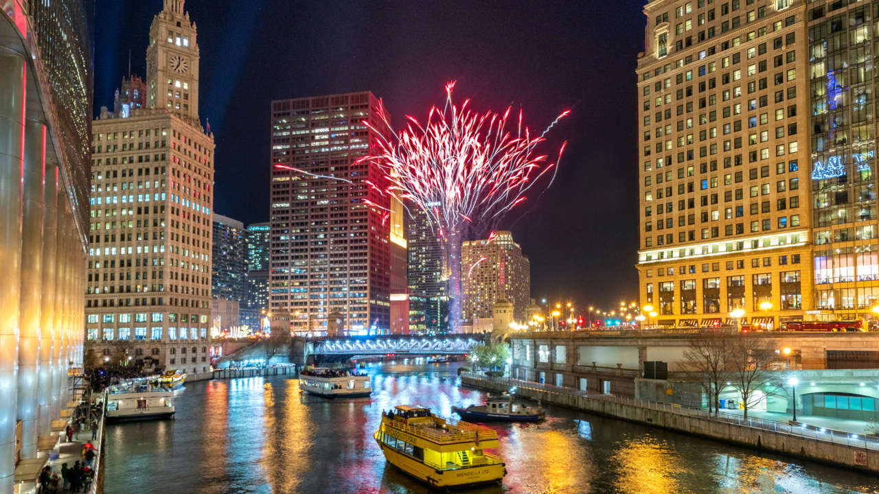 Fireworks illuminate the night sky above the Chicago Riverwalk