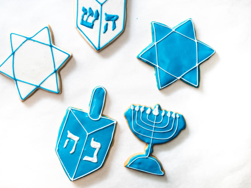 A collection of decorated blue-and-white Hannukah-themed cookies