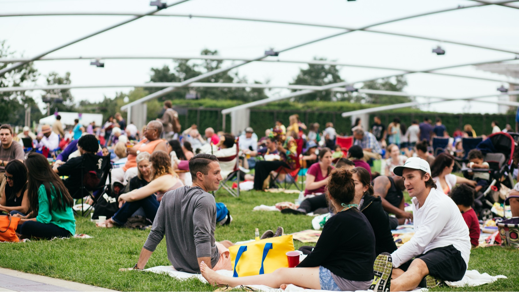 People outdoors at a performance at the Jay Pritzker Pavilion