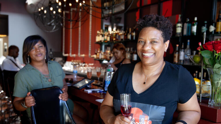 Owners of Nobody's Darling in front of their bar