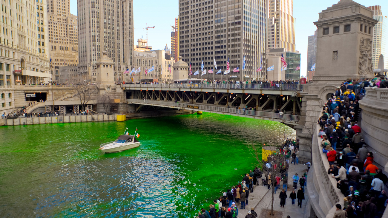 Crowds gathered along the Chicago River to watch the green river dying