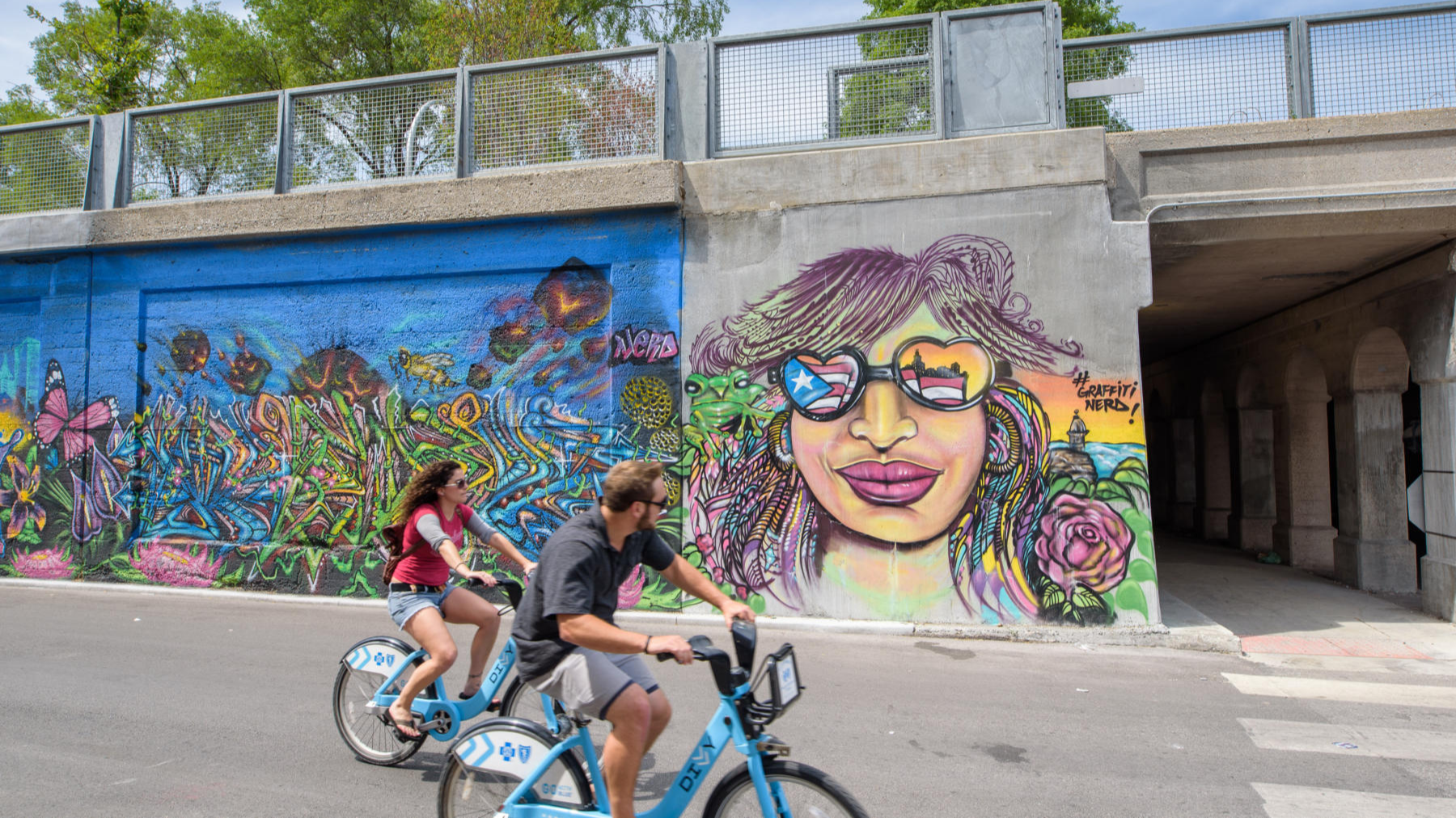 Two people biking alongside the 606 Trail