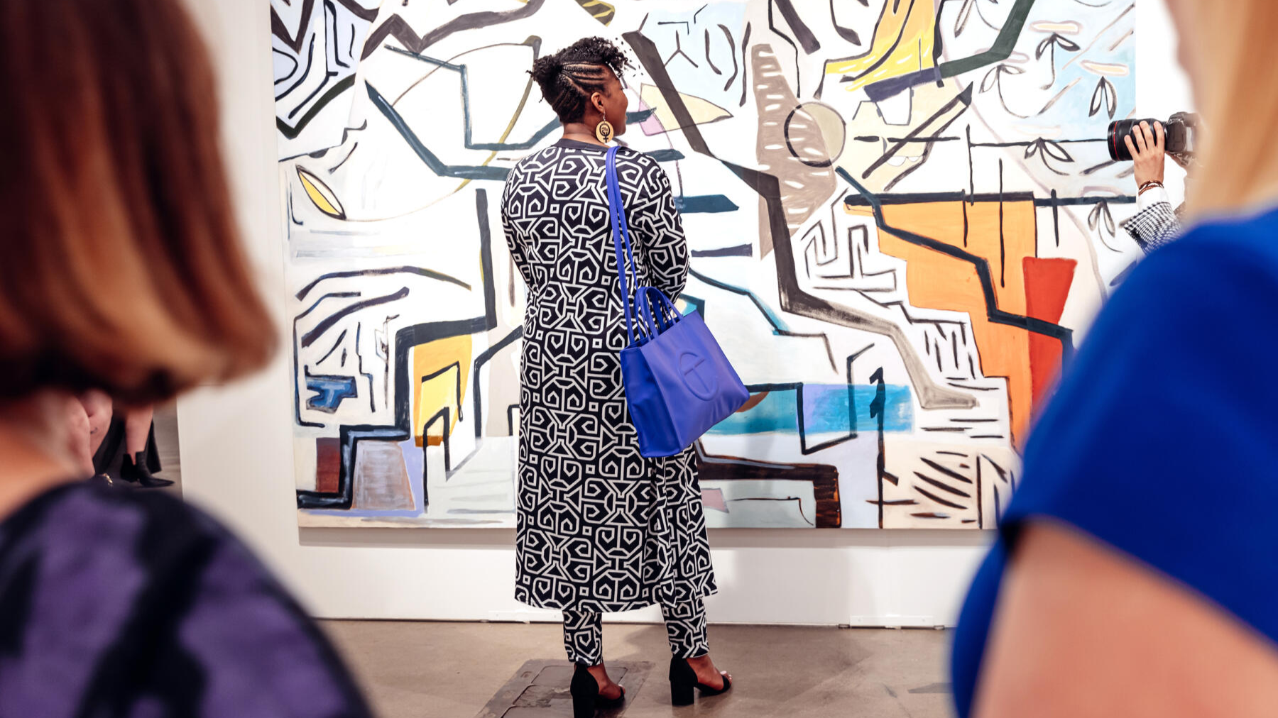 A woman admires an artwork at EXPO CHICAGO Contemporary Art Fair