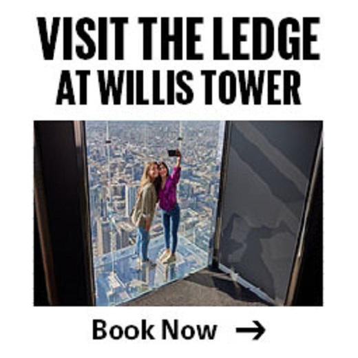 Two people take a selfie on The Ledge at Willis Tower