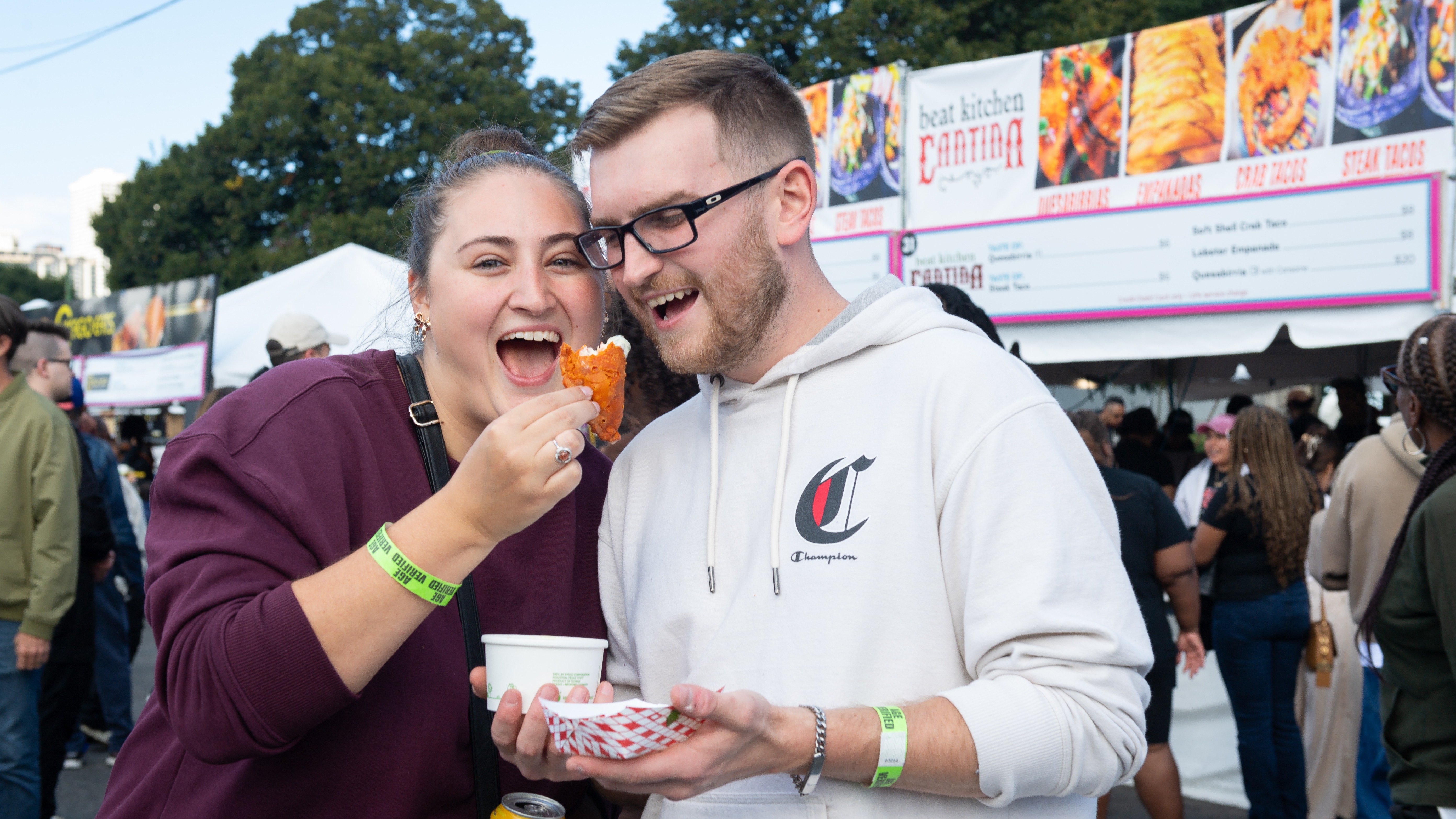 A couple shares a bite at a previous Taste of Chicago
