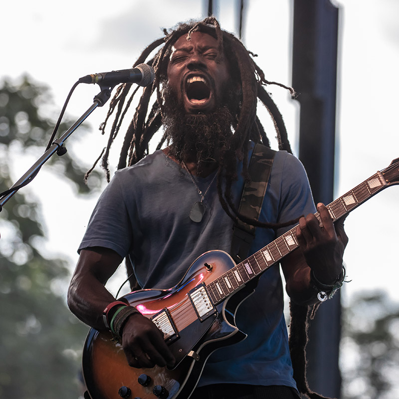 Image of a guitar player performing at ComFest. Photo credit: Ian C. Powell