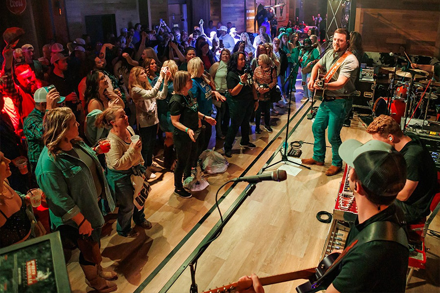 Image of a live music show at PBR Cowboy Bar