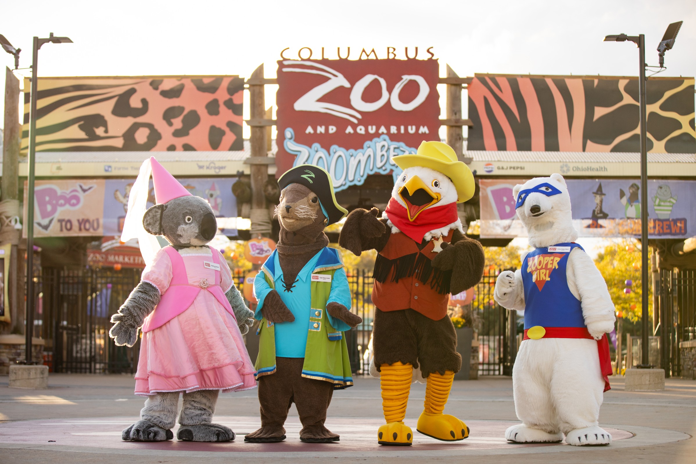 Four character ambassadors dressed in Halloween costumes at the Columbus Zoo and Aquarium