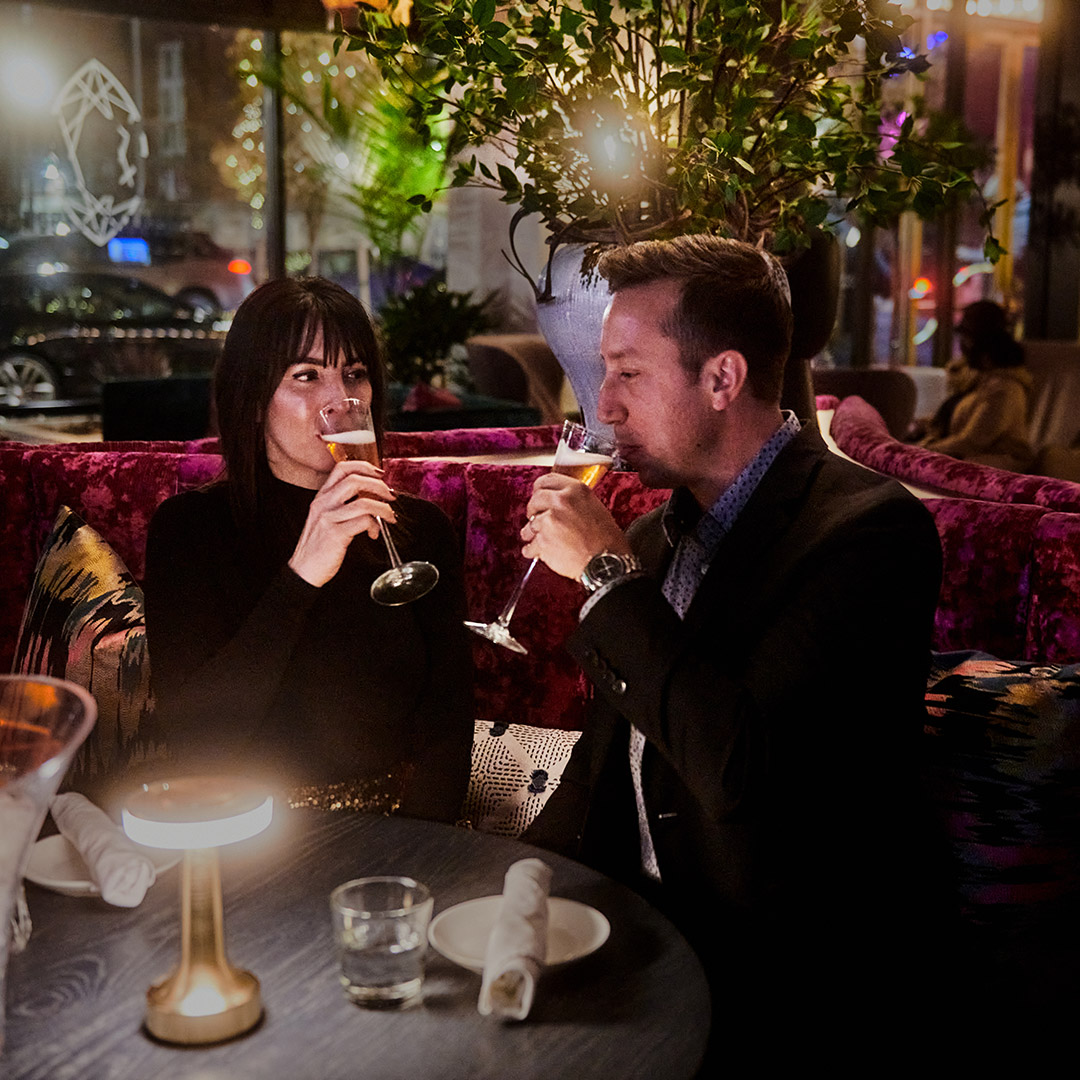 Image of two people at a restaurants