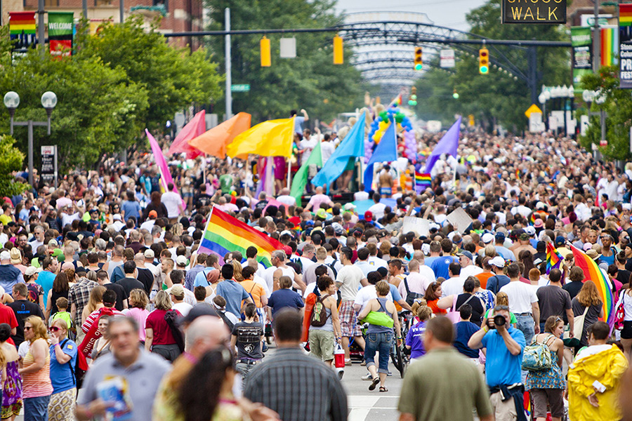 Image of marchers in a Pride Weekend parade in Columbus.