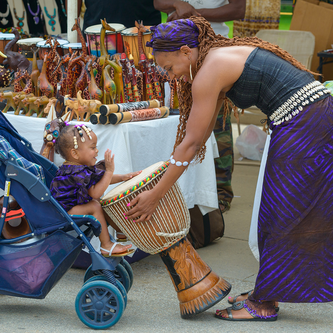 Image of a woman and a child at a Juneteenth celebration.