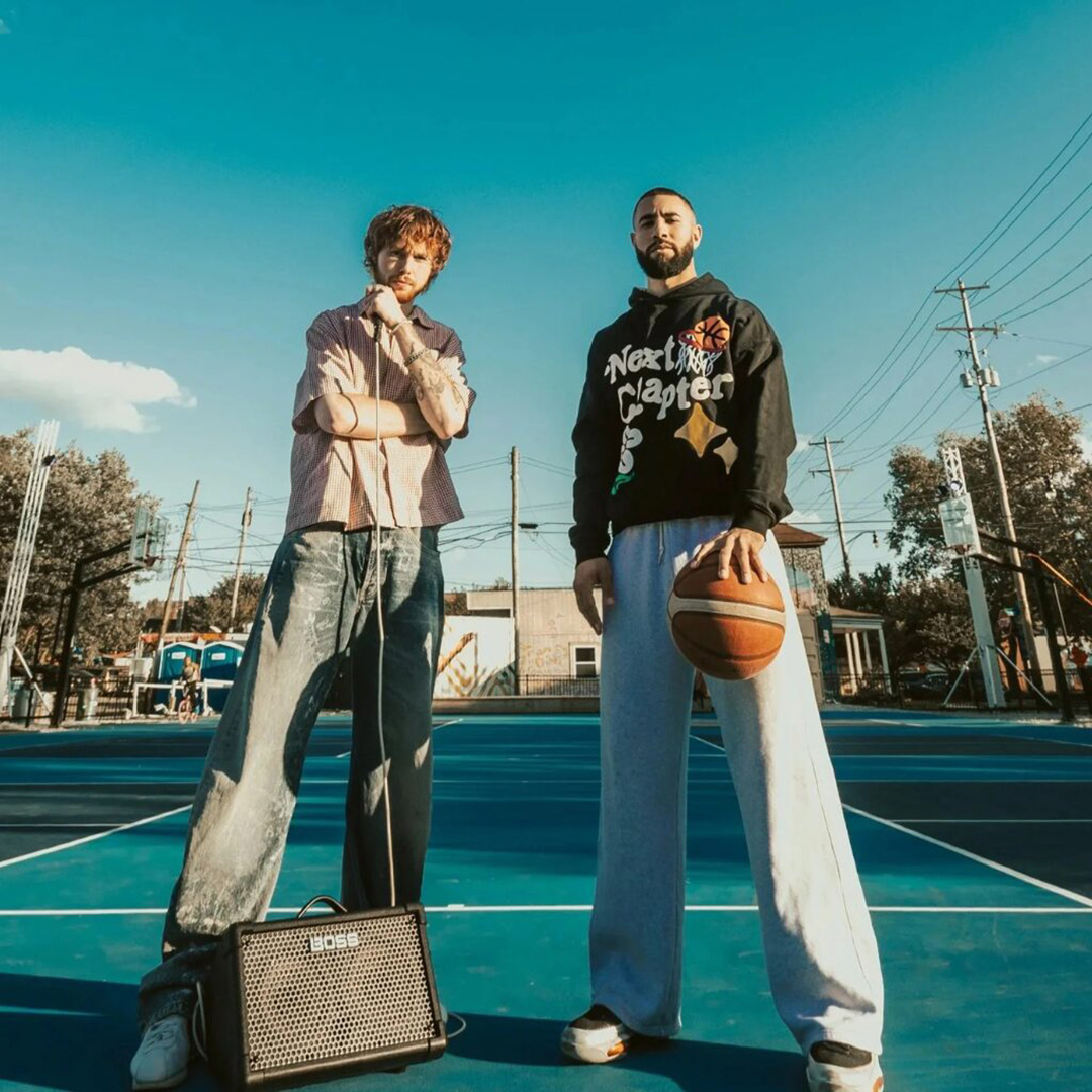 Image of two basketball players on a court.