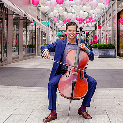 Man playing cello at Palmer Alley
