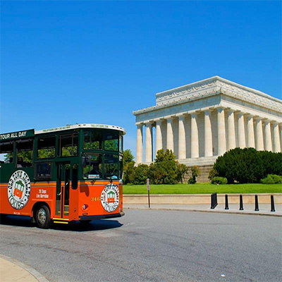 An Old Town Trolley passing the Lincoln Memorial on a tour. 