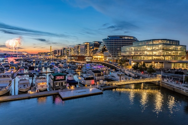  Fireworks light up the sky over The Wharf as boats line the marina at sunset in Washington, DC.