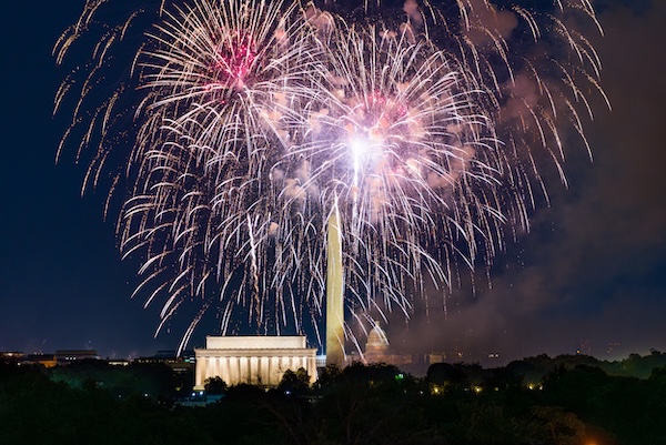 Fireworks light up the night sky above the Lincoln Memorial and Washington Monument in Washington, DC during Fourth of July celebrations.