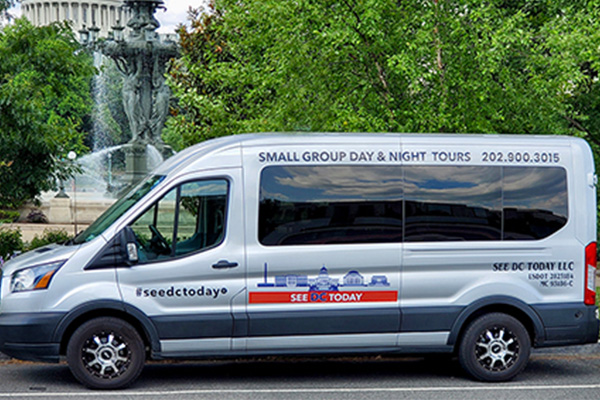 See DC Today tour van parked in front of a fountain in Washington, DC.