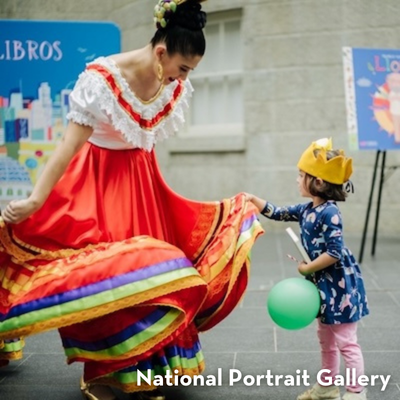 A dancer in a colorful traditional dress twirling while a child watches at the National Portrait Gallery.