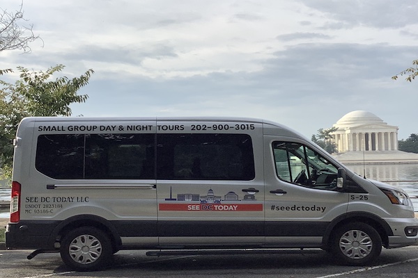 A See DC Today tour van is parked by the Tidal Basin with the Jefferson Memorial visible in the background.