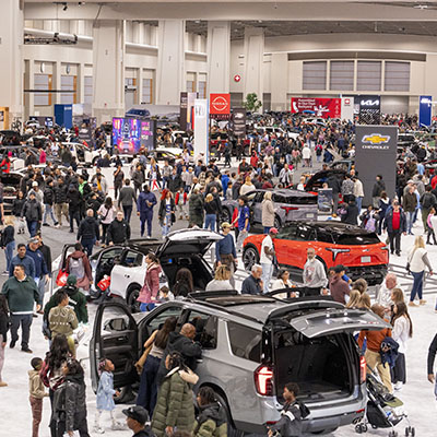 Crowds explore new vehicles and interactive displays at the Washington Auto Show in Washington, DC.
