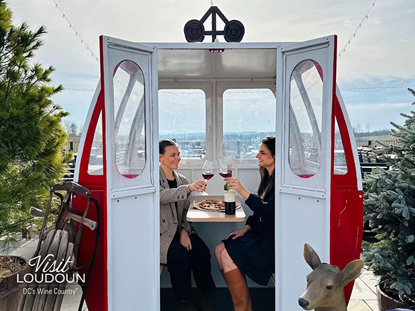 Enjoying red wine inside a ski gondola at Stone Tower Winery in Leesburg.