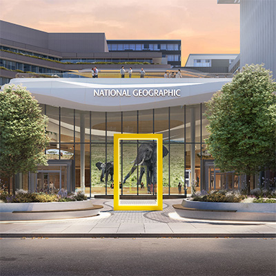 Exterior view of the National Geographic Museum courtyard in Washington, DC, featuring the iconic yellow frame at the main entrance.