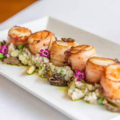 A colorful scallop entrée from Magnolias at the Mill in Purcellville.