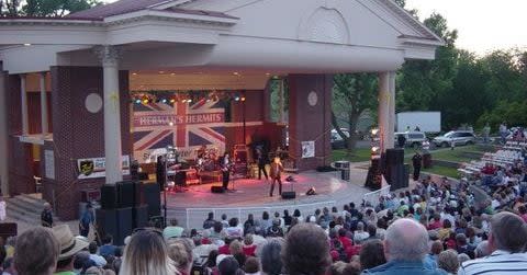 Concert in front of a British Flag at the Banks of the Wabash Festival