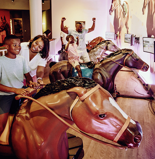 Family enjoying their time at the Kentucky Derby Museum
