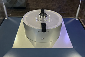 a round white object with a black strap on top