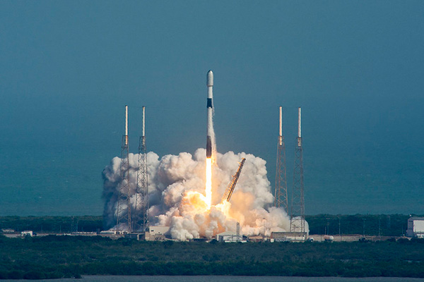 a rocket launching with smoke and fire