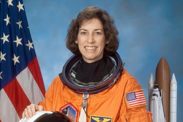 a woman in an orange space suit