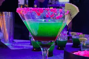 a glass with a drink in it