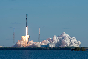 a rocket launching with smoke and clouds of smoke