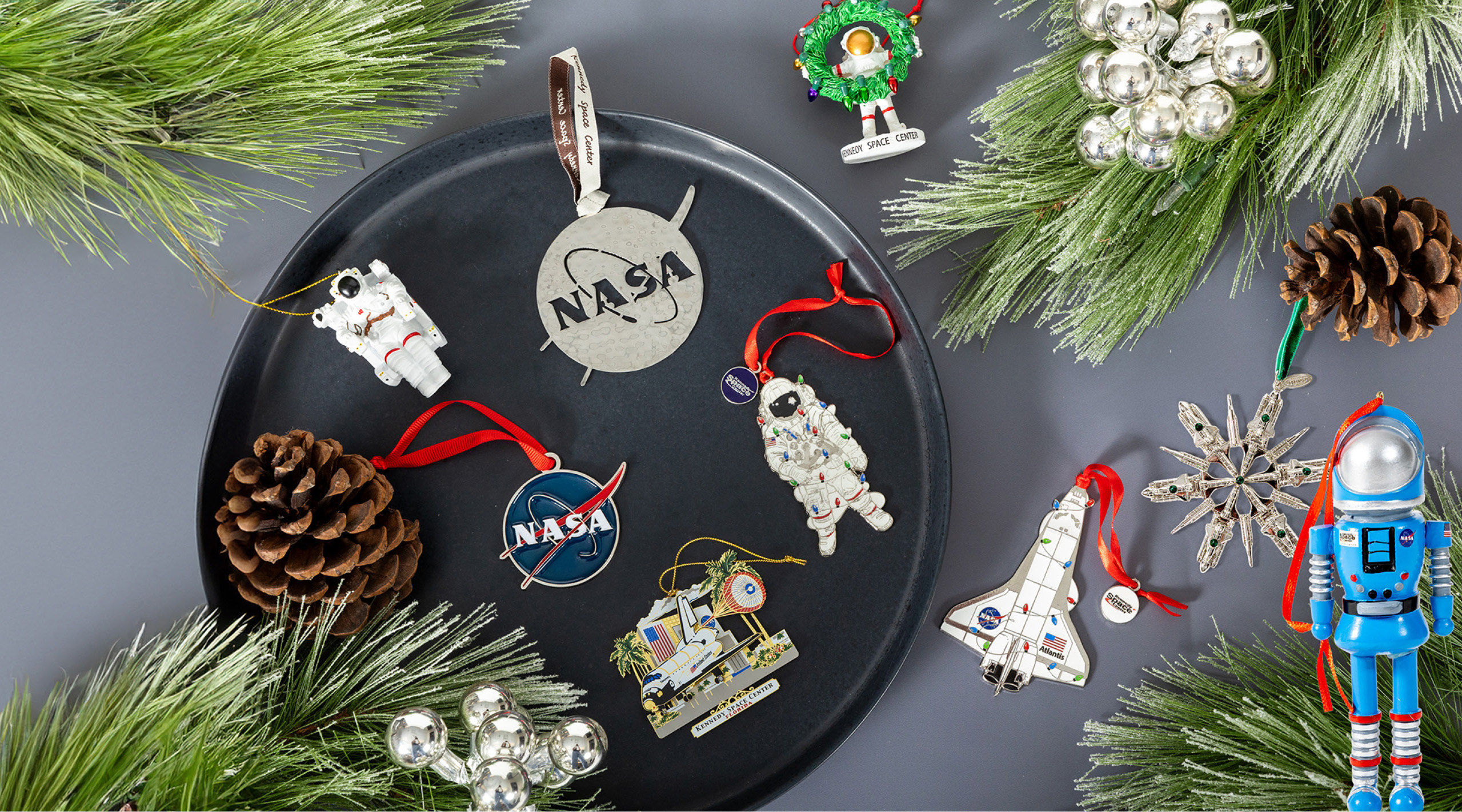 a group of space themed ornaments on a tray