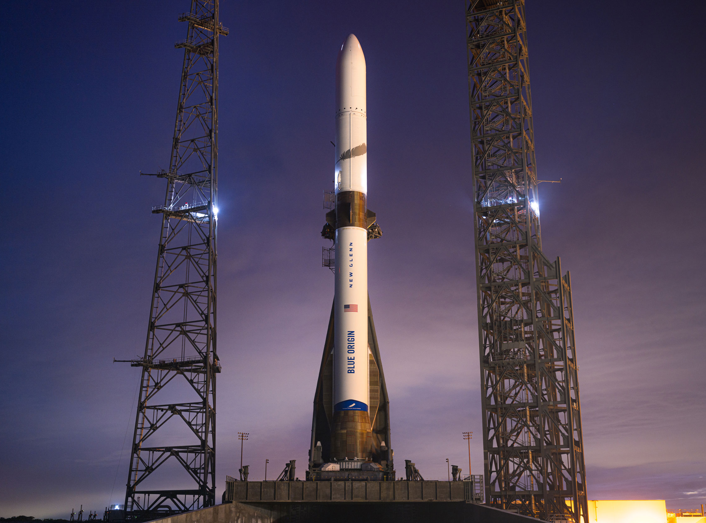 a rocket on a platform with metal towers