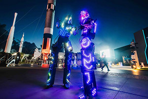 two people wearing lights on their legs