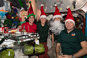 a group of people wearing santa hats