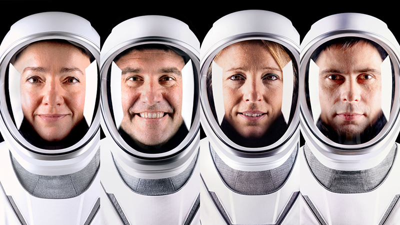 a group of people wearing a space suit