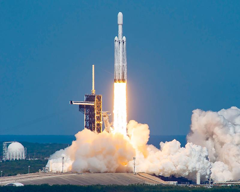 a rocket launching with smoke and fire