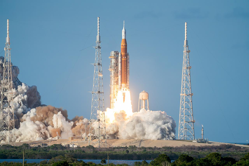a rocket launching with smoke and clouds of smoke