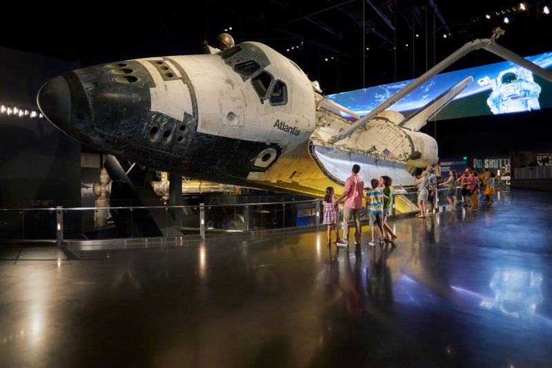 people looking at a space shuttle