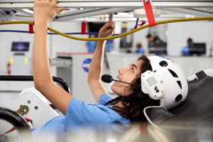 a woman wearing a helmet and holding a cable