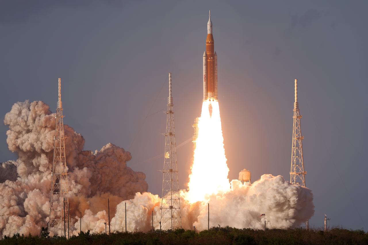 a rocket launching with smoke and fire