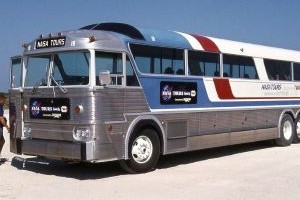 a silver and red bus