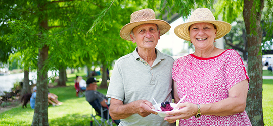 A couple enjoying a dish at the Louisiana Blackberry Festival.
