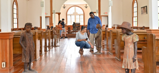 people viewing an old curch